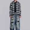 Colossus Jeans XL z podartymi nogawkami i ukrytym wzorem kamuflażu