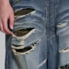 Colossus Jeans XL z podartymi nogawkami i ukrytym wzorem kamuflażu