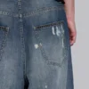 Colossus Jeans XL z podartymi nogawkami i ukrytym wzorem kamuflażu