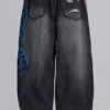 Czarne Colossus Jeans XL z przetarciami i nadrukiem Spike Airbrush