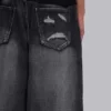 Czarne Colossus Jeans XL z przetarciami i nadrukiem Spike Airbrush