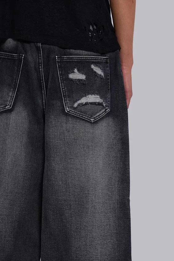 Czarne Colossus Jeans XL z przetarciami i nadrukiem Spike Airbrush