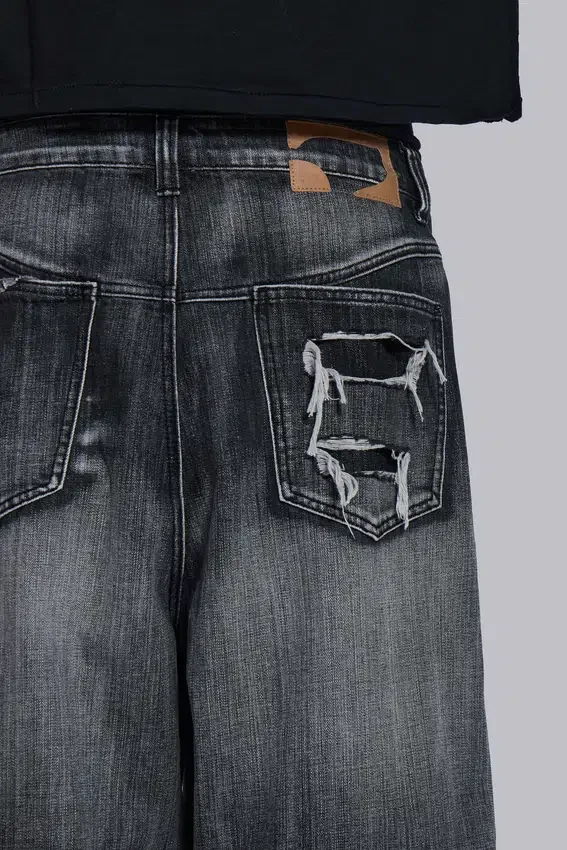 Czarne jeansy XL Colossus z efektem erozji