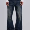 Jeansy Indigo Jude Bootcut z przetarciami