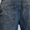 Niebieskie jeansy „Jude Bootcut” z rozszerzanymi nogawkami w odcieniu „Mid Wash”