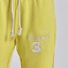 Spodnie dresowe Cleo o luźnym kroju typu bootcut w kolorze neonowym