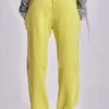 Spodnie dresowe Cleo o luźnym kroju typu bootcut w kolorze neonowym