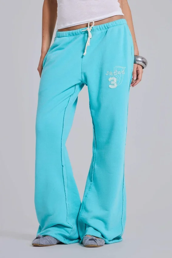 Spodnie dresowe Cleo o luźnym kroju typu bootcut w kolorze turkusowym
