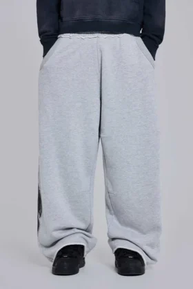 Szare, melanżowe spodnie dresowe typu Monster Joggers z gotyckim nadrukiem „Monster”