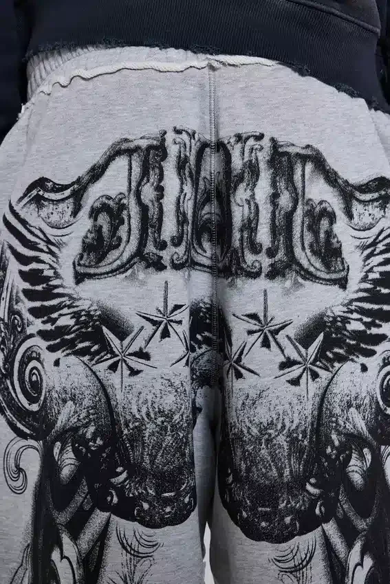 Szare, melanżowe spodnie dresowe typu Monster Joggers z gotyckim nadrukiem „Monster”