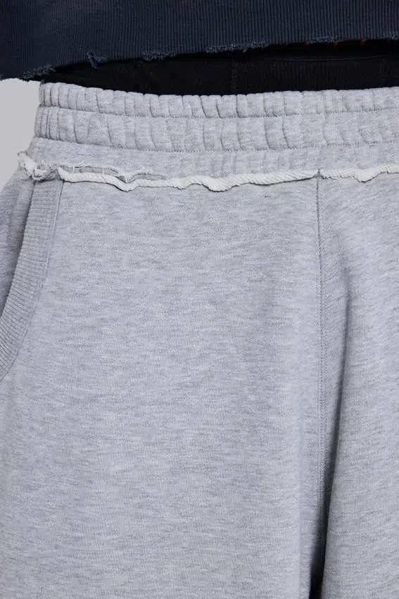 Szare, melanżowe spodnie dresowe typu Monster Joggers z gotyckim nadrukiem „Monster”